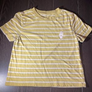 Mustard yellow crop top with white strips and a hand design